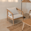 Contemporary minimalist wood armchair sofa chair with natural timber frame and plush white cushion by WoodBee Craft