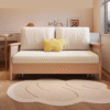 1 Japandi minimalist fold out wood sleeper sofa cum bed with light cream cushions and woven rattan cane side arms by WoodBee Craft