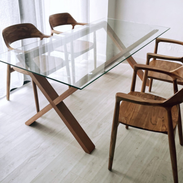 1 Modern minimalist glass top x base dining table with light natural solid wood frame and matching curved armchairs by WoodBee Craft