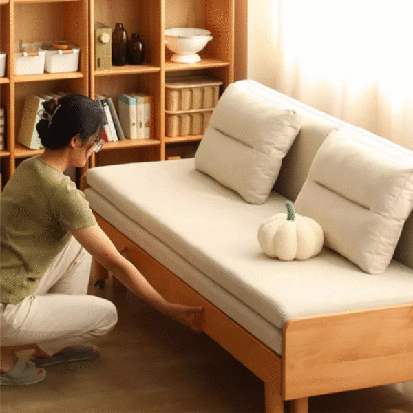 Japandi minimalist extendable solid wood daybed sofa cum bed with cream cushions and light natural wood frame by WoodBee Craft