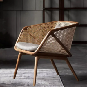 Modern rattan barrel accent chair with woven mesh back and grey cushions by WoodBee Craft